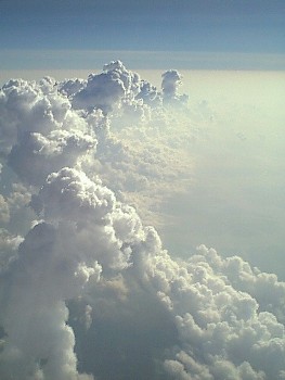 This photo of a cloud wall at 25,000 ft. was taken by photographer Keith Syvinski of Franklin, Indiana.  (I thought it had a God-like magnificence about it ... and a hint of Empyrean Heaven.)  